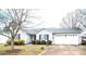 A beautiful house showing great curb appeal, with mature trees, a green lawn, and an attached two-car garage at 3248 St Vincent Dr, Claremont, NC 28610
