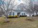 Charming single-Gathering home features manicured landscaping, a well-kept lawn, and a classic facade with a red front door at 3248 St Vincent Dr, Claremont, NC 28610