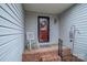 Cozy front porch with a red-trimmed front door, a rocking chair, and brick-lined steps for welcoming appeal at 3248 St Vincent Dr, Claremont, NC 28610