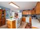 Charming kitchen featuring a center island, wood cabinetry, and modern appliances at 3248 St Vincent Dr, Claremont, NC 28610