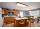 Charming kitchen featuring an island with seating and an adjacent dining area with a warm and inviting atmosphere at 3248 St Vincent Dr, Claremont, NC 28610