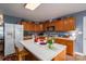 Charming kitchen featuring a center island, wood cabinetry, and modern appliances at 3248 St Vincent Dr, Claremont, NC 28610
