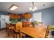 Charming kitchen with island adjoined to a wooden dining table at 3248 St Vincent Dr, Claremont, NC 28610