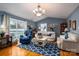 Cozy living room with vaulted ceiling, wood floors, and a sliding door leading to a deck for indoor/outdoor living at 3248 St Vincent Dr, Claremont, NC 28610