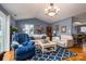 Bright and airy living room featuring vaulted ceilings, wood floors, and neutral-toned furniture for a relaxing ambiance at 3248 St Vincent Dr, Claremont, NC 28610