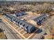 An aerial view showcasing colorful townhomes with individual entrances and a centralized parking area at 330 Malvern Sw Ave # A, Concord, NC 28025