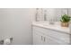 A modern half-bathroom featuring a white vanity with granite countertop and contemporary fixtures at 330 Malvern Sw Ave # A, Concord, NC 28025