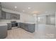 Bright, open kitchen with stainless steel appliances, sleek countertops, and ample cabinet space at 330 Malvern Sw Ave # A, Concord, NC 28025