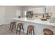 Modern kitchen with stainless steel appliances, white cabinets and countertop seating at 330 Malvern Sw Ave # A, Concord, NC 28025