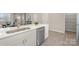 Bright kitchen with stainless steel dishwasher, and white cabinetry at 330 Malvern Sw Ave # A, Concord, NC 28025