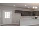 Modern kitchen with stainless steel appliances, dark cabinets, and a breakfast bar at 330 Malvern Sw Ave # A, Concord, NC 28025