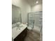 Clean and modern bathroom with a walk-in shower, vanity with solid surface counters and a large mirror at 334 Knotty Wood Dr # 68, Monroe, NC 28110