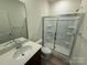 Bathroom featuring a tiled shower, modern sink, and tiled floors at 334 Knotty Wood Dr # 68, Monroe, NC 28110