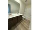 Bathroom featuring double sinks, a large mirror, and a shower-tub combination with a tiled surround at 334 Knotty Wood Dr # 68, Monroe, NC 28110
