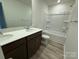 Bright bathroom with a double sink vanity and a shower-tub combination at 334 Knotty Wood Dr # 68, Monroe, NC 28110