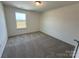 A cozy bedroom with a window offers a comfortable and bright space at 334 Knotty Wood Dr # 68, Monroe, NC 28110