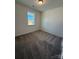 Cozy bedroom with plush carpeting and a bright window, creating a comfortable and inviting space at 334 Knotty Wood Dr # 68, Monroe, NC 28110