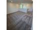 Large bonus room with plush carpeting and ample natural light, perfect for a playroom or media center at 334 Knotty Wood Dr # 68, Monroe, NC 28110