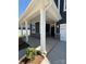 Inviting covered front porch with stone accents, providing a cozy and stylish entry to the home at 334 Knotty Wood Dr # 68, Monroe, NC 28110