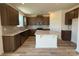 Open kitchen featuring an island, stainless steel appliances, and granite countertops at 334 Knotty Wood Dr # 68, Monroe, NC 28110