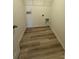 A functional laundry room with wood-look flooring and essential hookups for appliances at 334 Knotty Wood Dr # 68, Monroe, NC 28110