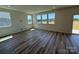Bright, sunlit room featuring hardwood floors, neutral paint and ample windows at 334 Knotty Wood Dr # 68, Monroe, NC 28110