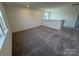 Loft area featuring neutral paint, carpet flooring, and one window at 334 Knotty Wood Dr # 68, Monroe, NC 28110