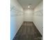 Walk-in closet with ample shelving space and plush neutral carpeting for organization at 334 Knotty Wood Dr # 68, Monroe, NC 28110