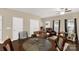 Cozy dining area featuring a unique round table, dark wood floors, and neutral paint at 446 Clouds Way Way, Rock Hill, SC 29732