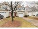 Delightful townhome with a one-car garage, warm beige siding, and neatly trimmed front yard bushes at 446 Clouds Way Way, Rock Hill, SC 29732