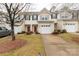Charming townhome with a one car garage, red front door, and freshly landscaped front yard at 446 Clouds Way Way, Rock Hill, SC 29732