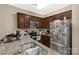 Well-lit kitchen featuring granite countertops, stainless steel appliances, and ample cabinet space at 446 Clouds Way Way, Rock Hill, SC 29732