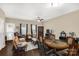 Cozy living room with a ceiling fan, hardwood floors, and plenty of space for relaxing and entertaining at 446 Clouds Way Way, Rock Hill, SC 29732