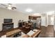 Open-concept living space with a fireplace, dining area, and dark hardwood floors at 446 Clouds Way Way, Rock Hill, SC 29732