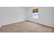 Bright bedroom with neutral carpet, a window for natural light, and ample space for furniture at 4708 Tradd Cir, Monroe, NC 28110