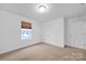 Comfortable bedroom featuring neutral carpet, a window, and a closet for ample storage at 4708 Tradd Cir, Monroe, NC 28110