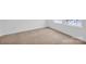 Bright bedroom featuring plush carpeting and abundant natural light from a large window at 4708 Tradd Cir, Monroe, NC 28110