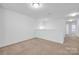 A bright bonus room provides flexible living space and neutral carpet flooring at 4708 Tradd Cir, Monroe, NC 28110
