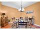 Dining room features designer lighting, a glass table, and seating for four at 4708 Tradd Cir, Monroe, NC 28110
