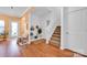 Welcoming entryway with hardwood floors, built-in bench, and staircase at 4708 Tradd Cir, Monroe, NC 28110