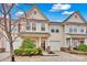 Charming townhome with attached garage, manicured landscaping, and inviting entrance, bathed in natural light at 4708 Tradd Cir, Monroe, NC 28110