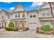 Inviting townhome with a well-maintained lawn, garage, and a cozy front porch at 4708 Tradd Cir, Monroe, NC 28110