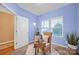 Serene office with a comfortable chair, natural light, and a view of the backyard at 4708 Tradd Cir, Monroe, NC 28110