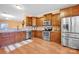 Kitchen with stainless appliances, wood cabinets, and eat-in breakfast area at 4708 Tradd Cir, Monroe, NC 28110