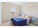 Comfortable bedroom with blue accents, natural light, and carpet flooring at 50143 Robins Nest Ln, Lancaster, SC 29720