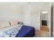 This cozy bedroom is adjacent to the en suite bathroom at 50143 Robins Nest Ln, Lancaster, SC 29720