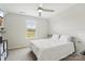 Cozy bedroom with a window view, ceiling fan, and neutral decor for a relaxing and airy ambiance at 50143 Robins Nest Ln, Lancaster, SC 29720