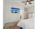 Bedroom with a ceiling fan, carpet flooring, and wall-mounted television at 50143 Robins Nest Ln, Lancaster, SC 29720