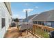 Outdoor wooden deck features patio table with umbrella, chairs, and outdoor furniture seating area at 50143 Robins Nest Ln, Lancaster, SC 29720