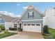 Beautiful home featuring manicured lawn, attractive landscaping and an attached garage at 50143 Robins Nest Ln, Lancaster, SC 29720